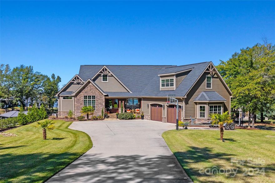 WELCOME HOME to your personal oasis!!! Breathtaking views await you from this magnificent 5 bed/6 bath custom waterfront home w/ newly built entertaining dock featuring a boat lift, two jet ski ramps, internet, tv & water. This extraordinary home is the epitome of luxury & tranquility. Boasting an impressive 5,309+ sq. ft. of living space, it offers a harmonious blend of comfort & sophistication. As you step inside, you'll be greeted by an inviting open floor plan that effortlessly combines style & functionality. The quality of build is evident in every corner, from the carefully curated materials to the impeccable finishes. Large windows allow natural light to flood the living spaces, creating an airy & inviting atmosphere throughout. A fully finished walkout basement doubles your living space & provides easy access to the heated freshwater pool and lake. With awarded Clover schools, low SC taxes, no HOA & just a stone's throw away from restaurants & shopping, this home has it ALL!