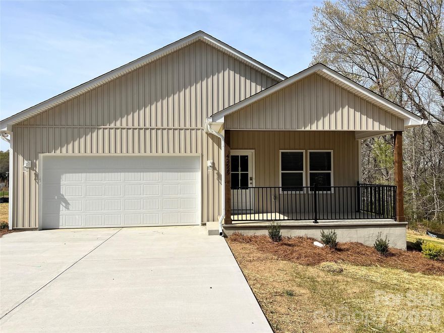 New construction - Semi custom build without the hassle of building.  Situated on 0.70 acres - great private lot with pasture and tree line views.  Exterior is upgraded vinyl siding with oversized gutters. Excellent floorplan with easy level entry. Open concept living, kitchen and dining with a spacious walk-in pantry. Quartz counter tops and island. Large primary bedroom/bath with easy entry shower with glass doors and two walk-in closets. Split bedroom floor plan. All closets and pantry feature custom shelves.  Rear covered porch (12X15) with great views and privacy. Conveniently located with easy access to Hwy 24/27, 740, Northeast Connector as well as Hwy 52.