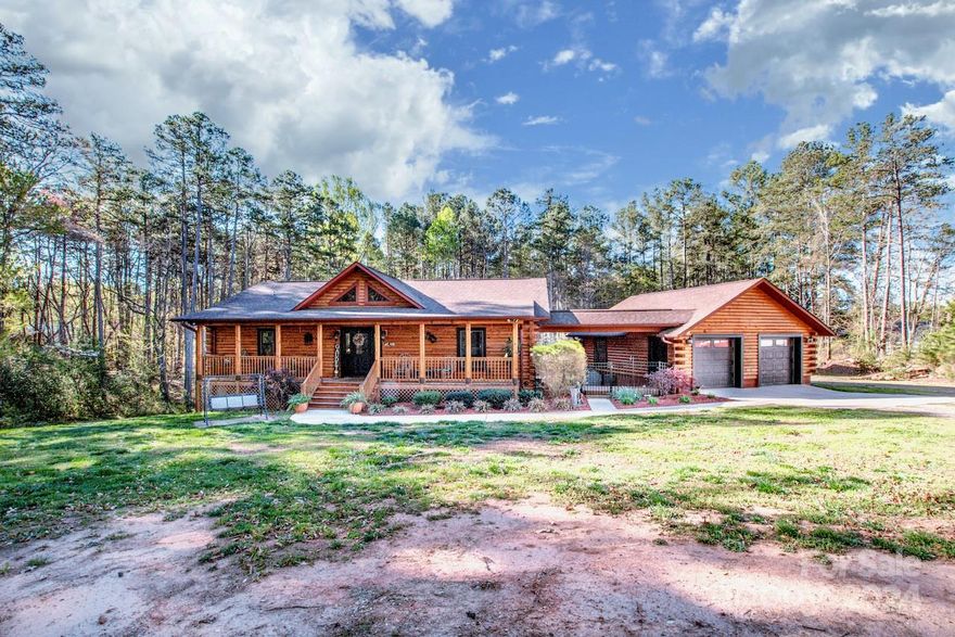 This one story log cabin offers open floor plan with three bedrooms, three full baths and two half baths on 4.1 acres of land. Beautiful hardwood flooring on main level and all tile floors in basement. There  is a screen porch off the primary bedroom with a Jacuzzi for relaxing on cold winter nights. Kitchen offers granite countertops, stainless steel 
appliances and breakfast bar. Make you way downstairs to a full basement with two bedrooms, two full baths and half bath for quests.
Home offers inground swimming pool, greenhouse and a 30 X 40 building to use as workshop.
Home is partially fenced.  Seller is offering an America's Preferred warranty on home for buyer not to exceed $500.00.
Dog pen will be removed and the lawn in dog pen will be  will be seeded and strawed.

Seller is a licensed real estate agent in NC.
