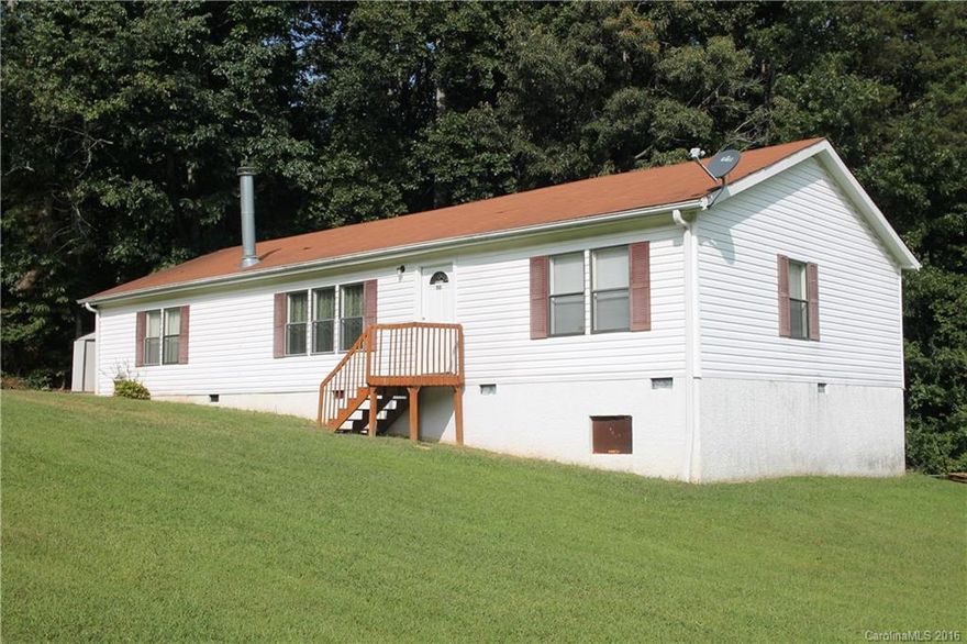 Step inside this well maintained 3 bedrooms 2 bath manufactured home on a large corner lot in a quiet neighborhood. Master on main with large bathroom, garden tub, and walk-in closet.  Kitchen with beautiful cabinets and Laundry room with an access to backyard. Dining room access to back porch. Wood burning fireplace. Freshly painted and new carpet installed throughout house. MOVE-IN-READY!