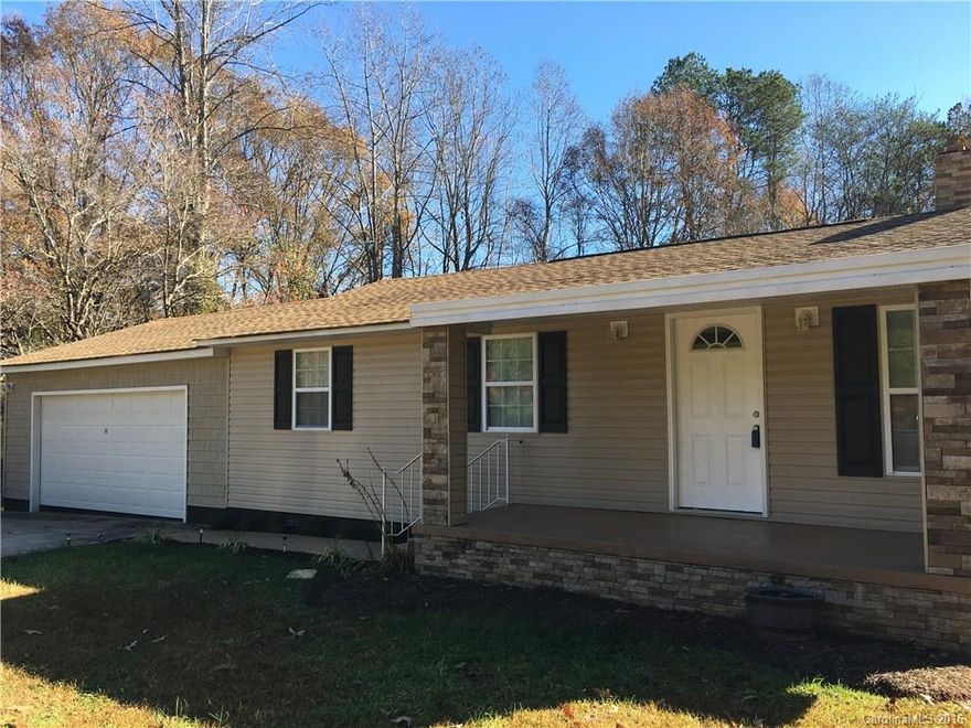 Very nice remodeled home tucked away on private lot.  Double attached garage!   Nice front porch and back deck overlooking yard.  Storage building.