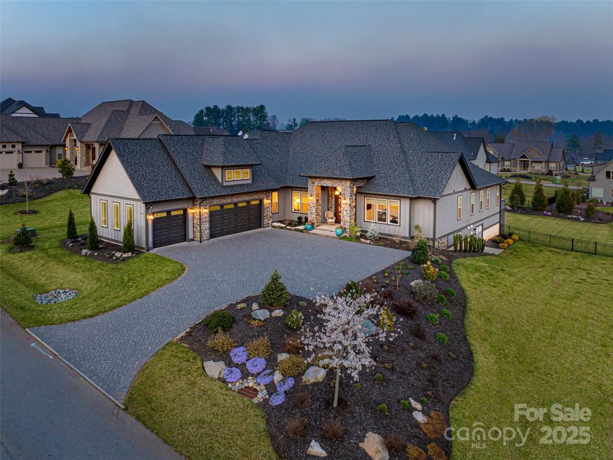 Nestled amid thoughtfully designed and fenced landscaping, this exquisite home showcases
luxury and easy one-level living. Step inside to soaring vaulted ceilings, accentuated by
Restoration Hardware lighting and an open-concept floor plan that seamlessly connects the spacious great
room to a chef’s kitchen, where honed granite countertops, premium KitchenAid appliances, and an
island create the perfect space for entertaining. Retreat to the fully screened porch complete with a
stacked stone fireplace, the perfect backdrop for creating lasting memories. The primary suite is a serene
sanctuary, boasting dual walk-in closets and a lavish bath with an indulgent double-entrance shower and
deep soaking tub. Well-appointed guest suites provide exceptional comfort and privacy. French doors open to a large office with built in cabinetry. Designed for
today’s living, there's a whole-house generator and EV charging
station in the 3 car garage, ensuring low-maintenance & modern comfort.