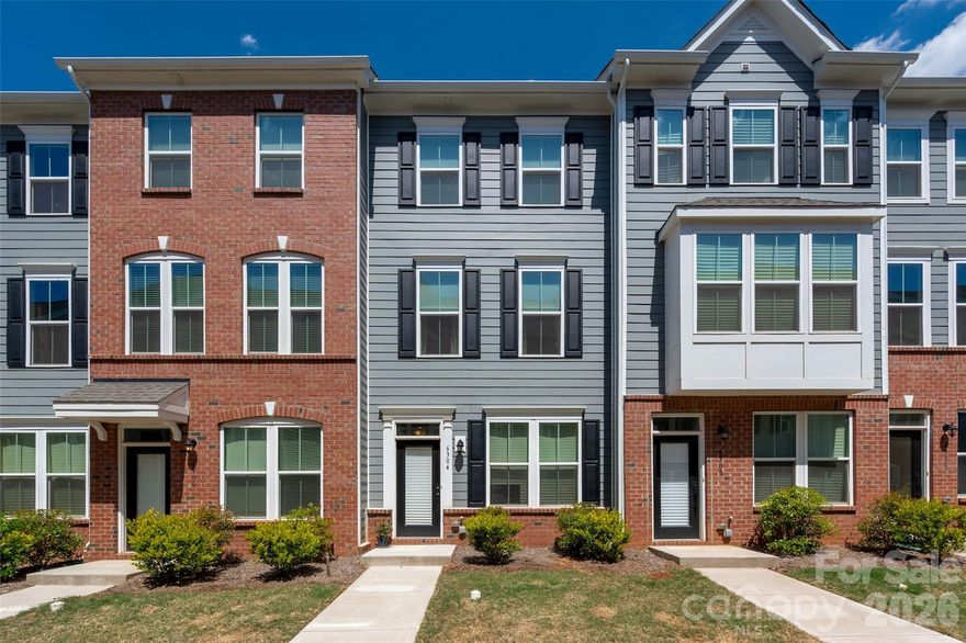 Experience urban LoSo living at its best—just steps from the light rail for unbeatable convenience. This move-in ready home features luxury vinyl plank flooring, stylish light gray 42" cabinetry, gray subway tile backsplash, granite countertops and custom shades! Enjoy a private terrace perfect for relaxing or entertaining, along with a rare 2-car tandem garage offering plenty of storage. Inside, the bright and open layout is complemented by neutral paint throughout. The spacious kitchen shines with a large island, stainless steel appliances and abundant storage, including a pantry and additional utility closets. The split-bedroom floor plan provides ideal flexibility for roommates, guests or a home office. All appliances convey—including the refrigerator and in-unit stackable washer and dryer—making this an easy, turnkey opportunity. Enjoy a energy-efficient home with two HVAC zones and two smart thermostats you can control from your phone, low HOA dues, an unbeatable light rail location and quick access to major roadways. Priced below tax value—this opportunity won’t last!