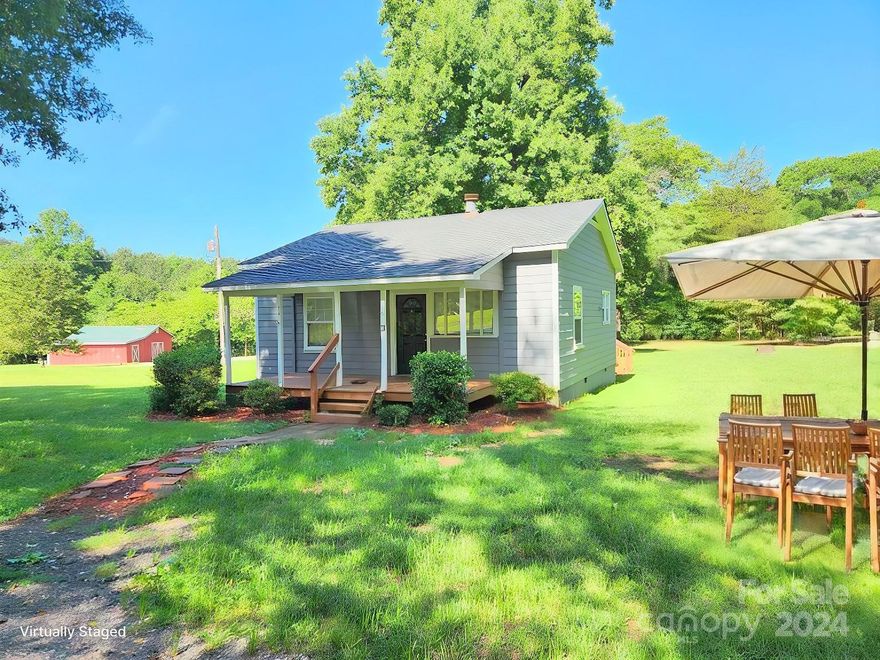 Move right in!  Sweet two bedroom home with an acre lot.  Enjoy country living at its best on your rocking chair front porch.  Ready to add your special touches to make it your own!