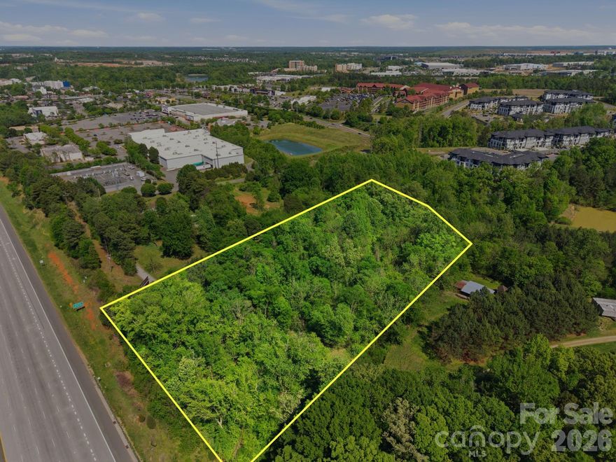 Nestled in a desirable Mecklenburg County location just minutes from Concord Mills, this beautiful 2.567-acre wooded parcel offers the perfect blend of privacy and convenience. Tucked away on a private road, the property provides a peaceful, natural setting while still being close to shopping, dining, and major highways—including easy access to I-85.

Mature trees and a gently rolling landscape create an ideal backdrop for your future home or investment opportunity. A portion of the property lies within a designated flood plain, offering potential for creative site planning while preserving the natural surroundings.

Adding to its appeal, the property features an income-producing billboard with visibility from I-85, providing a unique opportunity for passive income while you enjoy or develop the land.

Whether you’re looking to build your dream home, invest, or take advantage of additional revenue potential, this unique acreage offers endless possibilities in a rapidly growing area.

Private showings with licensed agents only. Please do not visit the property without your agent.