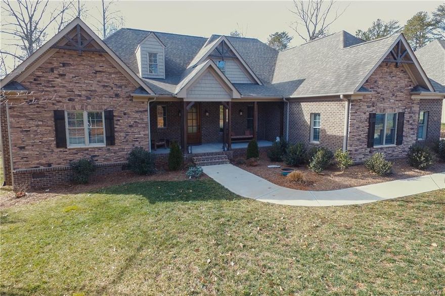 Gorgeous Custom Craftsman, full brick w/stone accents. Only 2 yrs old. Spacious 1.5 story w/ bonus, bed, and full bath up. Beautiful stone fireplace and coffered ceilings in family room. Kitchen has SS appliances, gas cooktop,  double ovens, large island and granite. Wetbar in Master. Granite in all Baths.  Covered porch off Master & Family Rm overlooking the large private wooded backyard. 3-car garage. Award Winning Ft Mill Schools! Minutes to 77, 485, & Ballantyne.  Bike to pool and Greenway.