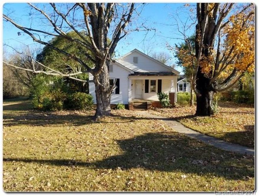 Awesome bungalow near many shopping and easy access to Interstate and HWY 74 in Lowell, NC! Home features rocking chair front porch, storage building, and has full of potential.