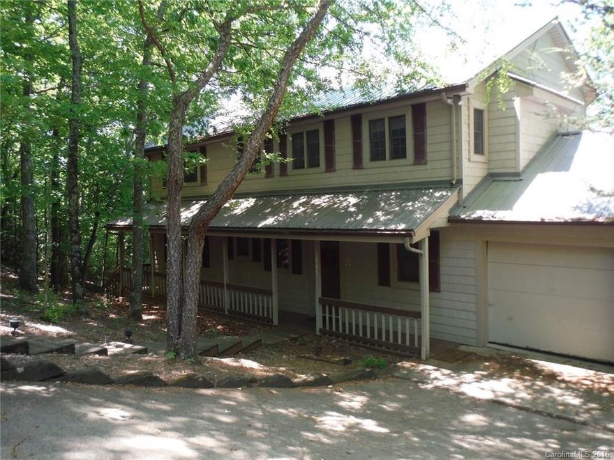 Incredible mountain views from this Rumbling Bald Resort home, perched high up on Young's Mountain yet only a few minutes to Lake Lure & all the surrounding areas have to offer! Wall of windows in Living room look out unto large deck & mountains beyond. Kitchen, dinning, & great room, are open, w/ unique woodburning fire place. 2nd story features balcony overlooking great room and mountains, 2 bedrooms, & bath. Lower level features bedroom & bathroom. Once you're here you won't want to leave!