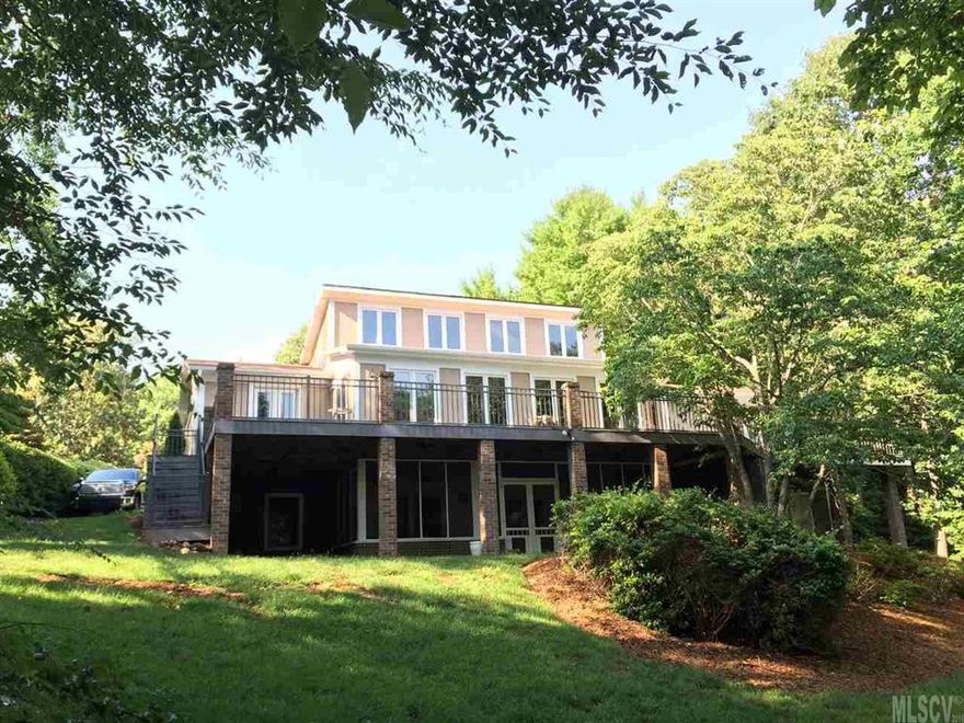 Very easy walk to water on private lot nestled in cul de sac! Covered boat dock AND boat house with large upper deck. Contemporary style home with lots of windows. Spacious deck sprawls the back of home with composite decking and pretty iron railing. Extra large sunroom overlooking lake off living room and kitchen. Loft area over living room with fireplace and soaring ceilings. Master bedroom provides dbl closets while bath offers separate shower and jetted tub. Walk out basement can accommodate a 2nd living quarters with living area, wet bar, bedrooms and bath. Even a wine cellar! Enjoy screened porch and covered patio off basement plus sgl garage.