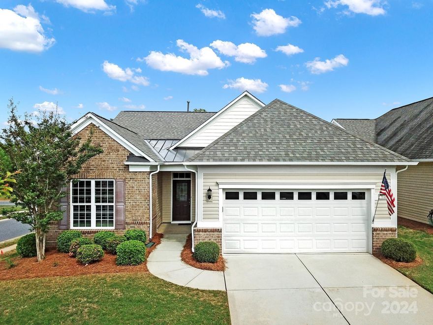 Beautiful Tifton Walk on a corner lot in 55+ Sun City! From the curb, you are welcomed by the partial brick front, manicured garden beds, & a decorative glass front door. Hardwoods flow throughout the home w/ tile in the bathrooms, & plantation shutters add a touch of elegance on most of the windows! The open floorplan features a kitchen w/ granite counters, electric appliances, a corner pantry, & an island w/ a bkfst bar overlooking the great room. The primary suite is at the rear of the home w/ a tray ceiling & an ensuite bath w/ a dual sink vanity, large glass shower, & a walk-in closet. 3 guest bedrooms have access to a full hall bath & are great for overnight guests. Or, use the additonal bedrooms as a home office or hobby room! Soak up the sun on the spacious rear covered patio! Other features: a whole-home water filter, air scrubber, & an extended garage w/ a sink & pulldown attic access for storage! Come see this home today!