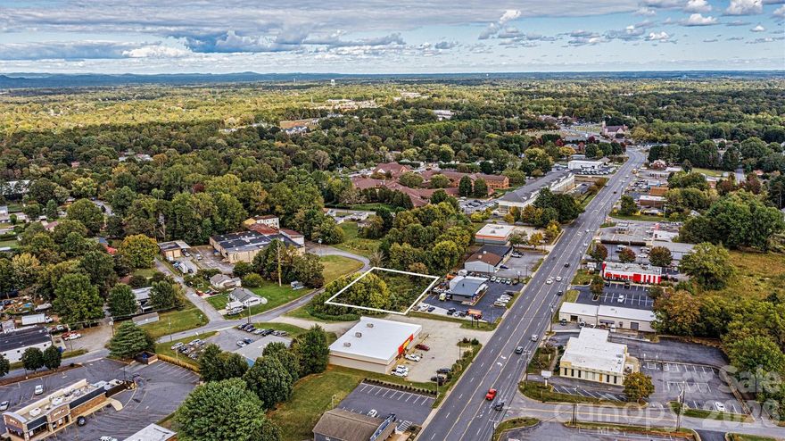 Excellent commercial development opportunity in the growing Northeast Hickory / Springs Road corridor. This 0.52-acre corner parcel on 12th Ave Place NE (adjacent to MLS # 4354881) offers an ideal location for a variety of development possibilities. Conveniently positioned near established businesses, restaurants, and retail along the Springs Road corridor, the property benefits from strong visibility and steady area traffic. With continued growth in Northeast Hickory, this site presents a prime opportunity for investors or developers looking to capitalize on a thriving commercial area.

Zoned C-2, the property allows for a wide range of potential uses providing an excellent opportunity for investors, developers, or business owners looking to establish a presence in a growing commercial area.

City water and sewer lines are located nearby; however, extension and tap fees will be required for connection. Buyers are encouraged to reference the City of Hickory Land Development Code for additional information regarding utility connections and development requirements.  Ideally located of Springs Road, with easy connectivity to I-40, Hwy 127 and more. 

Call Dana Gibson at 828.217.1215 for additional information.