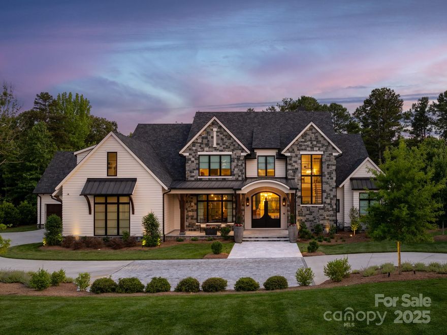 2021 home built by Arcadia in gated community in Weddington with 7,000sf + 4 car garage on 1 acre cul de sac lot with water view. Custom double entry doors lead to foyer w/2 story cable rail staircase. Private office & wet bar on main + walk in climate controlled glass wine storage. Spacious Great Room w/stacking sliding doors, built ins + gas fireplace.Kitchen includes a Wolf 6 burner gas range, hood, warming drawer, 2 dishwashers, coffee center & scullery. Main floor also features a convenient fitness room & sauna.Primary suite includes a spacious custom closet + luxury bath including heated tile floors. Upstairs features 4 large secondary rooms, each w/ walk in closet & full bath.2nd floor also includes a large bonus room w/wet bar. Outside showcases an amazing outdoor kitchen w/large island, gas grill w/commercial hood, ice maker, beverage center + Kegerator. Relax in the heated pool w/vanishing edge or enjoy a wood burning fire under the stars.