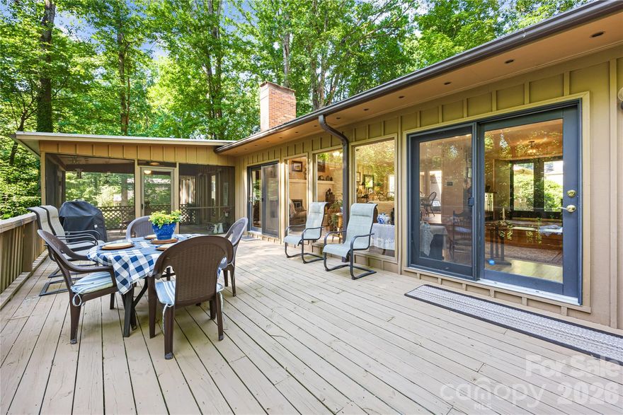 Updated ranch with amazing mountain like feel with towering trees and lush landscaping, rock beds and lots of foliage. Living areas have had new floors installed for a beautiful flow and excellent for entertaining. There is a large formal living room in the center of the home with large stone fireplace & adjoining dining room that look out over the back yard. A family room with expansive windows & fireplace for more casual get togethers. A large screen porch is perfect for dining outside year round or sit on the deck & watch the wildlife. The home office also has a wonder view & built-ins for library or study. The primary bedroom with it's update ensuite, dual vanities and his & her closets. There are two additional bedrooms that share an updated bath. The kitchen is spacious with large pantry, island & breakfast area. Laundry and half bath just off the kitchen area. There is an oversized workshop off the 2 car garage & WAIT until you see the basement DREAM workshop & all the storage!!