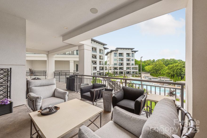Experience elevated living in this expansive 3BR/3.5BA condo with private office, set on the premier third floor of gated Watermark Lake Norman. A standout feature is the rare 700 sq ft covered wraparound lanai, offering sweeping views of the resort-style saltwater pool—ideal for refined outdoor entertaining. Inside, design details shine with herringbone hardwood floors, coffered ceilings, and a gas fireplace with mantle. The gourmet kitchen is appointed with a Wolf range, Sub-Zero refrigerator, walk-in pantry, and discreet pocket doors for seamless flow. The owner’s suite features a spa-like zero-entry shower and elegant finishes and walkiin closet. All bedrooms include plantation shutters for enhanced privacy. Amenities: saltwater pool, fitness center, pickleball court, putting green, clubhouse, outdoor kitchen, firepit, and dog park. Two deeded garage spaces and a large storage unit included. Prime location near Lake Norman, 20 miles from Charlotte Douglas International Airport.