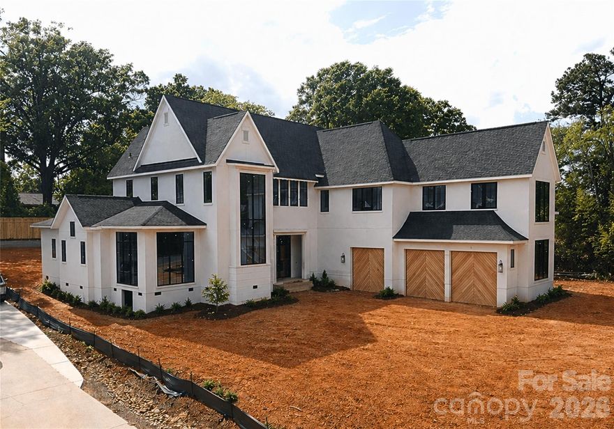 Welcome to 5622 Timber Lane, located in the sought after Mammoth Oaks neighborhood. This stunning 5,750 sq ft new build features 6 bedrooms and 5.5 bathrooms and a pool with modern finishes that bring both style and elegance to everyday living. Step through the large pivot door into a spacious great room with 12' ceilings, offering views of the large covered porch and yard. The primary suite features a vaulted ceiling, direct access to the patio, a spacious walk-in closet with an island, and a luxurious bathroom that includes a sauna. You’ll love the open floating staircase, visible through oversized windows with a massive chandelier in the private courtyard entrance. Upstairs, you’ll find four more bedrooms and several flexible spaces with a bar area that can adapt to your lifestyle. A separate staircase takes you to a private living area, kitchenette and full suite above the garage that is perfect for guests, a home office, or even a quiet getaway. The outdoor living features an expansive patio with a fireplace, a pool with an enormous hot tub and an eight feet tall privacy fence. The front elevation features wood garage doors, a large pivot door and paver driveway.