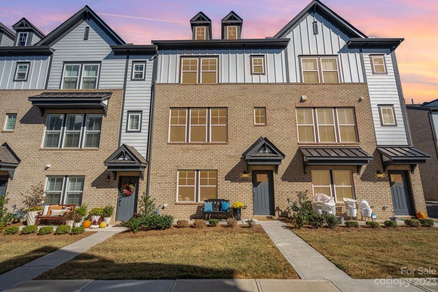 Gorgeous like-new townhome with city views! $71,000 in upgrades selected! This 2021 Taylor Morrison townhome has been well maintained and offers 3 bedrooms, 2.5 bathrooms, 2 car garage, a balcony, and a beautiful terrace with a view of uptown. You'll love the two story foyer, with a flex area off the garage which you can use as an office, gym, or extra family room. On the main level you'll find the gourmet kitchen with gray cabinets, white quartz, touchless kitchen faucet, gas cooktop and upgrades such as the beverage/wine center. Next to the spacious kitchen is another upgrade: a dedicated office space/ home management center. Private balcony just off the kitchen. The third level offers a primary bathroom with double vanity, walk in shower and walk in closets, plus two more bedrooms and bathroom. The fourth floor is the showstopper- with a large terrace perfect for entertaining. No HOA rental cap. Easy exterminator access with Pestban system and a neighborhood dog park.