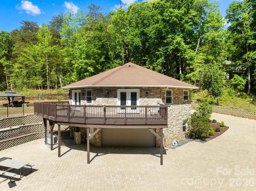 Welcome to a truly one of a kind octagon retreat set on 3 Acres Land with NO HOA in the heart of Charlotte. Tucked away behind a long fully paved winding driveway, this custom built home offers the perfect blend of privacy, character, and lifestyle.

Inside, you are welcomed by soaring vaulted beamed ceilings, an open concept layout, and slate and marble flooring that adds a distinctive upscale feel. Natural light fills the space and flows seamlessly to a spacious upper level deck, perfect for relaxing or entertaining while enjoying peaceful wooded views. The home also features beautifully customized bathrooms and a luxurious primary suite with a walk in dressing closet.

Step outside and enjoy your own private recreational space with pickleball and volleyball courts, creating a true retreat experience right at home.

All of this is just minutes from Charlotte Premium Outlets, Topgolf, SouthPark, and everyday shopping and dining, offering a rare combination of seclusion and convenience. A home like this is more than a place to live, it is a lifestyle.
