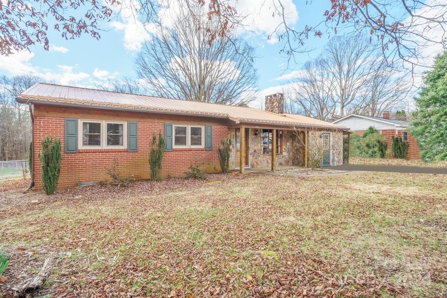 Nestled in the heart of Cajah's Mountain, this charming brick ranch home welcomes you with its spacious layout and inviting features. This home boasts 3 bedrooms with 1 full bath and 1 partial bath. The living room is adorned with a cozy brick fireplace, creating a warm and welcoming ambiance perfect for relaxing evenings. Stepping outside, the fenced backyard awaits, providing an ideal space for entertainment and leisure activities. Conveniently located minutes from downtown Lenoir, this property offers both convenience and charm. Don't miss the chance to experience this lovely home in person – schedule a viewing today!