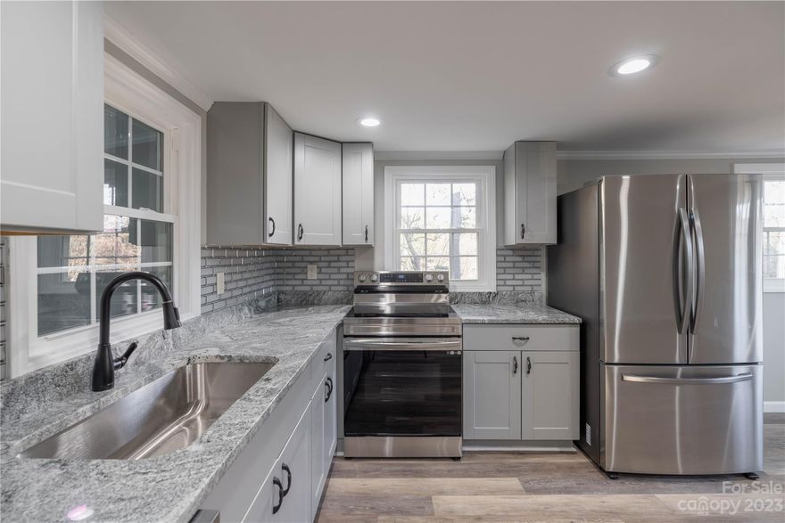 Dont miss out on this fully updated home with county taxes, no hoa, and no restrictions. Home has septic, and county water.  New windows, doors, floors, roof, water heater, hvac, appliances, floors, bathroom, lighting, electrical, granite countertops, tile backsplash.  This cute home also has a space (unheated square feet) for a office and closed porch.