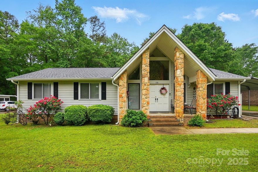 This delightful home in the wonderful Foxwood neighborhood offers a perfect blend of modern style & comfortable living, boasting recent renovations that will impress from the moment you step inside.  Be captivated by the 2 story stone fireplace and dramatic vaulted ceiling in the great room. The unique A-frame architectural design allows this impressive height to flow seamlessly from the front to the back of the house, creating an airy & spacious atmosphere. The former patio has been enclosed to create a fantastic screened porch. This wonderful space, trees and privacy fencing  provides the ideal space to relax, dine al fresco, & enjoy the Carolina breezes bug-free! Imagine sipping your morning coffee or unwinding after a long day in this serene space.
This charming home in a sought-after Fort Mill location offers more than just stunning updates. Enjoy the convenience of nearby amenities, excellent schools, and the welcoming community atmosphere that Fort Mill is known for.