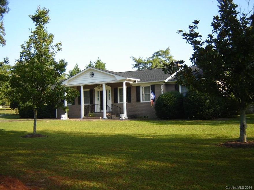 Beautiful country setting all brick offers space for entertaining or lg groups. Enormous GR w/beautiful hrdwds, lots of light & gorgeous stone fpl (wood burning). Oversized formal areas. KT & Brkfst w/ceramic floors/ tons of beautiful cabs & solid surface ctops - Brkfst continues w/serving buffet & gas log fpl.  Inside well trimmed  w/mostly hrdwd flrs. Lg multi purpose laundry rm, 2 patio areas.