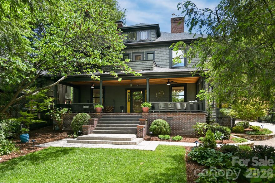Discover the perfect balance of historic charm and modern luxury in this iconic American Foursquare, just one mile from downtown Asheville in the prestigious Grove Park neighborhood. This beautifully restored home features a chef’s kitchen with a 48” Mercury Induction Range, expansive island and folding patio doors that open to a meticulously landscaped private patio bringing the outside in. Original details include five working fireplaces, hardwood floors and timeless millwork complemented by spa-inspired bathrooms, light-filled living spaces and a covered porch that echoes the home’s historic character. Outside, curated landscaping creates a private retreat that includes a private patio and a detached 460 square foot studio—ideal for a home office or creative retreat. Located in one of Asheville’s most desirable neighborhoods, this is a rare opportunity to own a piece of the city’s architectural history while enjoying modern comfort & design. The home has deeded access to the alley way behind the home that only 3 homes have access to.