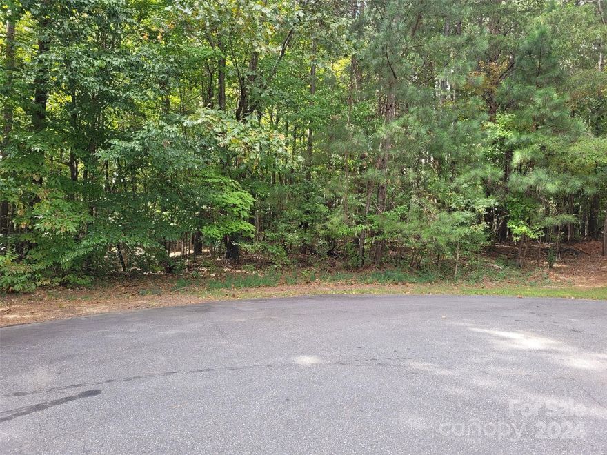 What a deal!!! Picturesque 2.36 acre wooded, level lot in quiet cul-de-sac. One of the best values in Mooresville/28117!  Look no further for your private lot with the ability to build while maintaining the ambience and privacy this land offers in a NON-HOA Lake Norman community. The Preliminary Septic Evaluation performed in Aug 2017 by a certified soil scientist stated the lot was suited for a 3 or 4 BR home (letter in attachments).  Don't miss this opportunity to own acreage in this serene lake community with potential winter views of LKN from the rear! Kindly schedule all showings through Showing Time.  Priced to sell....seller invites all reasonable offers!