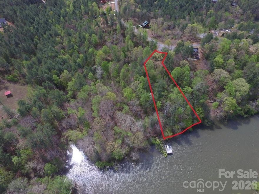 Build your private lakeside retreat at 3202 Bear Paw Ave NW, Valdese — a rare lakefront parcel in the gated Waterside community offering 200+ feet of pristine shoreline on beautiful Lake Rhodhiss. With a gentle slope ideal for a cabin-style build (minimum 600 sq ft), this property provides direct water access, long-range views, and exceptional privacy.
Waterside is a quiet, rustic-inspired community featuring a shared community boat dock, perfect for boating, kayaking, and fishing. Protective architectural guidelines help preserve the neighborhood’s natural character and long-term value — a major advantage as true lakefront opportunities become increasingly limited.
Wildlife Note:  
A bald eagle nest is located on the adjacent parcel. Construction activity near eagle nests may require review under the Bald and Golden Eagle Protection Act. Permits are available through the U.S. Fish & Wildlife Service, and a nearby lot with a completed cabin was built without reported issues. Buyers are encouraged to verify any permitting requirements or timelines with USFWS and local authorities during due diligence.
This lot is ideal for a vacation home, short-term rental, or peaceful private getaway in one of Lake Rhodhiss’s most scenic gated communities