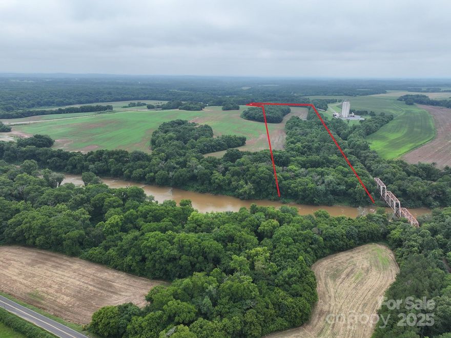 Riverfront Property - Rare Rare opportunity to purchase land on Rocky River.  Approximately 36 acres with over 300 feet of river frontage.  Property fronts on Deep water not far from the Forks into the Pee Dee River.  Hunting, fishing, and water sports await you on this amazing property.  Currently there is a kayak/canoe launch diagonally across the River at the Norwood Hand Carry boat launch. This gives you access before you make your own. Property is currently being farmed and there should be build-able areas on the property.  As with most River Front properties a portion of the property is in the Flood Zone.  Don't miss out on this property as it is truly Rare that River Front Property is for sale, schedule a showing today.