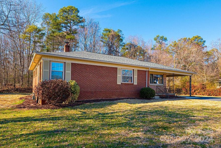 This renovated three bedroom home in NE Hickory shows like a brand new home! The covered front porch leads into an open great room with gleaming solid oak hardwoods, tons of natural light, and a dining area with coat closet. The kitchen features new marble-look LVP with new granite countertops, new stainless appliances and sink, new lighting, and doors to the covered rear deck and carport. All three bedrooms have new solid oak flooring and share a large hall bath with granite-topped vanity. Downstairs, enjoy a newly created laundry room with tons of space, plus over 1,000 SF of unfinished basement for your storage needs, or perfect for expansion! Additional updates include a brand new roof, brand new gas water heater, all new smooth drywall ceilings, all new PEX plumbing supply lines and new PVC waste lines, all new receptacles and light switches, all new door hardware, all new paint, updated lighting, and more! Convenient NE Hickory location with NO CITY TAXES!!