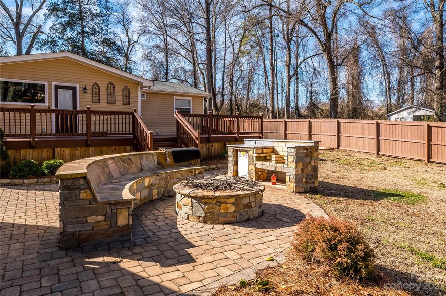 Virtually everything has been remodeled or replaced by the previous owner between 2020-2022. Current owner added a high-end Pure Life water filtration and purification system. Wait until you see the beautiful features of this home from the exposed beams, fabulous kitchen with gorgeous granite top island, built-in wine chiller, gas cooktop stove and sliding barn doors on pantry to the oversized deck leading you to the impressive outdoor living area complete with stone grill, bench and fire pit on the large fenced and flat yard offering privacy and enjoyment. Be sure turn on the ceiling fans which are also BlueTooth accessible. Exterior building is insulated and has electricity and window AC for your own home office/business or storage. Custom built chicken coop could also make a great kennel or protected garden area. Only a few minutes to Winthrop University and shopping/dining areas in a growing area.