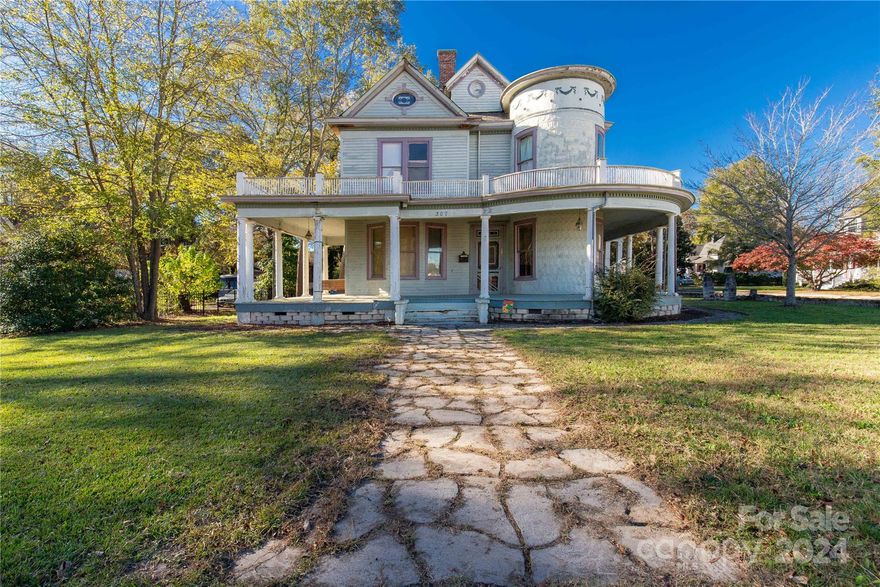 A remarkable opportunity to own this Victorian beauty that made her debut in 1892!  Discover the history and charm that is still etched into this home including original doors, stained glass windows, claw foot bathtub, the hardwoods, and those fireplaces!  This showcases all the stories and memories of the past!  What this home brings is a spacious layout with over 3200 sq ft, 4 bedrooms, and 2 baths!  What she is searching for is someone who will preserve the historic design elements while updating and refreshing them to bring her back to her stunning glory!  The paver sidewalk leads to the gorgeous wrap-around porch with pillars that will have you hurrying for summer to return so you can sip sweet tea and share conversations.  Your outdoor space is divine with a 1/2 acre corner lot and vision creating an enchanting garden where you can relax and time slips away! Come Fall in love with this timeless treasure!