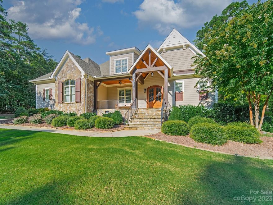 Stunning custom home by ES Johnson w/high-end finishes, trimwork & equipment throughout. Deeded boat slip (Pier Z, #27) with new lift! In-ground pool with spa, built-in firepit & waterfalls. Relax on the expansive pool deck and patio. Year-round you can enjoy the large screened room with self-lighting wood fireplace, built-in porch heaters, and an outdoor kitchen with built-in grill and beverage fridge. Inside are a spacious primary suite, an office or dining room off the barrel-vaulted entry hall, a great room with gas log fireplace, built-ins & vaulted coffered ceiling, another dining area, and a kitchen with huge island/breakfast bar, double-sized fridge, gas range & more. The barn door off the kitchen leads to a coffee bar and a huge pantry with additional fridge. Upstairs are bonus room, bedroom 4, a full bath & 2 walk-in attic storage spaces. Drop zone, laundry, computer niche, workshop, irrigation, landscape lighting & many other conveniences. Too many features to list them all!