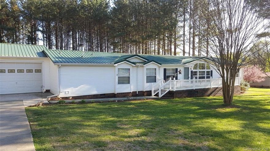Quiet cul-de-sac living in Iredell County! Need room for storage? Impressive, well-maintained home boasts 2car gar (26x28 w/cabs & work benches), 2car carport, 24x12 work shop + shed w/ramp (both w/electric).  Relax in spacious MB, bath w/jetted tub or separate parents retreat/sitting room.  Enjoy the private, flat backyard loaded w/pine trees. Kitchen has large island & sunny breakfast area. Metal Roof in 2012, newer flooring, wood burning FP w/blower & open floor plan.  No HOA!