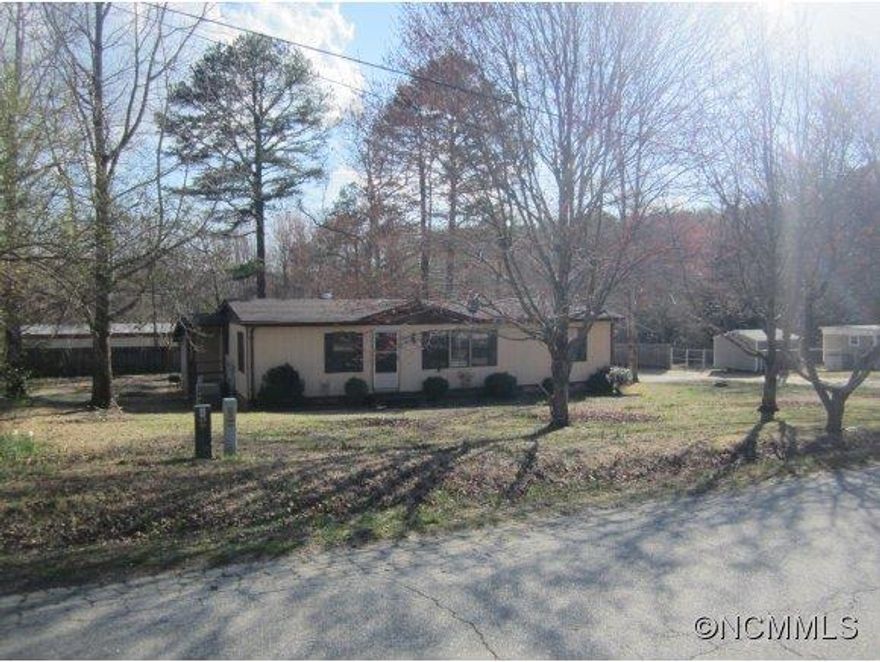 Walk to the Brookwood Park! Very close to town and elementary school!  Modular/mobile home built in 1984. Home is in good condition and sits on a permanent block foundation, has a combined tax bill, can be financed! Walk in closets, dining/living combo with built in shelves, carpet thru out, large carport, Storage room/ workshop partial privacy fence! EZ to show - call agent with questions!