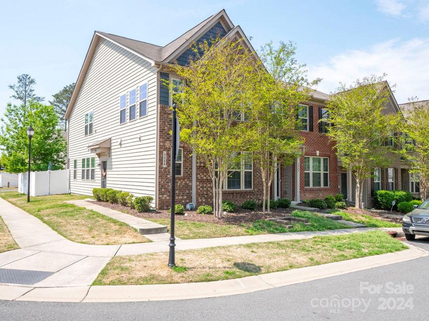 You are going to love this end unit's oversized, enclosed and private custom patio backyard! Perfect for morning coffee and evening fire pit gatherings. Desirable primary suite on main level floorplan. Primary bath has separate garden tub and shower. Double vanity sinks. 3 bedroom/2 full baths/1 half bath. Open granite and stainless kitchen with large island, pantry and gas stove. new built in microwave. Large dining area. Living room with corner gas fireplace and ceiling fan. Half bathroom off the foyer. Hardwood flooring on main level. Second level has a large multi-purpose loft with lots of windows. 2 additional bedrooms and full bath. Attic pull down stairs are encapsulated for additional insulation value. End unit has lots of additional windows. Premium finishes throughout. Oversized 1 car garage and cement driveway facing the rear of the home. Move in just in time to enjoy the community pool. Convenient shopping nearby.