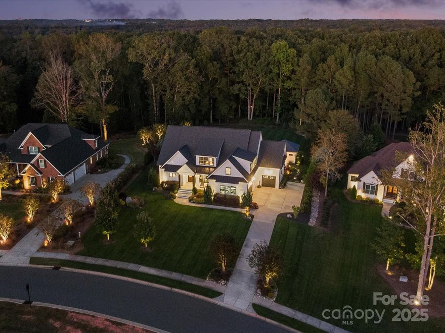 Exquisite and refined, this custom-built 5BR, 4.5BA home offers a rare opportunity to live in The Ridge—one of Fort Mill’s most sought-after luxury communities. Featuring over 4,500 square feet of meticulously designed living space, this home sits on a fenced, one-acre lot with the backyard offering your own resort-inspired oasis! 

Rich mahogany double doors welcome you to light-filled interiors, exquisite fixtures & details and site-finished hardwoods flowing seamlessly throughout the main level. The great room impresses with exposed beams, custom built-ins and sliders to screen porch. Open flow layout continue into a stunning white kitchen with an oversized island, walk in pantry and an expansive breakfast area overlooking the backyard. 

The main-level primary offers a serene retreat with a spa-inspired bath featuring walk-in shower, towel warmer, and spacious custom closet. A secondary bedroom with full bath on the main level provides ideal guest accommodations or multigenerational living. Upstairs, discover three additional bedrooms, an oversized bonus room ideal for media or recreation, and a beautifully finished office for today’s work-from-home lifestyle.

Outdoors, a private oasis unfolds—an inviting screened porch with fireplace offers the perfect spot to unwind, overlooking a heated saltwater pool and spa. The impressive pool house enhances the experience with a built-in grill, beverage fridge, full bath, storage room, and ceiling-mounted heater for year-round comfort. Gather around the gas firepit as the sun sets or dine al fresco on the patio—this backyard offers endless opportunities for relaxation and entertaining! Located near top ranked Fort Mill schools including the newest high school and minutes from the new Harris Teeter grocery and several restaurants, medical offices, etc. Newly opened Cotsco, Target plus additional retail are 15 minutes away as well as close proximity to I77. This one won't last long!