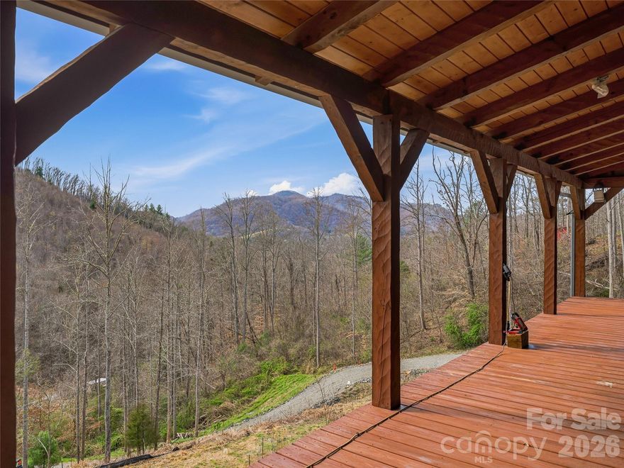 Whether you're dreaming of a private mountain escape, homestead, or investment project, this property offers incredible potential and space to make it your own.  Bring your vision to life on this exceptional 35-acre mountain property featuring breathtaking long-range views. This partially constructed log cabin is ready for completion, offering a solid start with well and septic installed (not yet connected), framing, sub-flooring, and partial plumbing already in place.   There is no electrical or HVAC currently installed.  Finish the home to suit your style while taking advantage of included materials such as a gas range/oven, dishwasher, two toilets, a modern bathtub, and a pedestal sink. The property also includes two 20' shipping containers for ample storage and two travel trailers—ideal for temporary living or hosting while you build.  Roads and trails run throughout the property for your exploration.  The property also includes a bobcat side by side for work or play.  Don't miss your opportunity to create a custom mountain getaway in a serene setting.