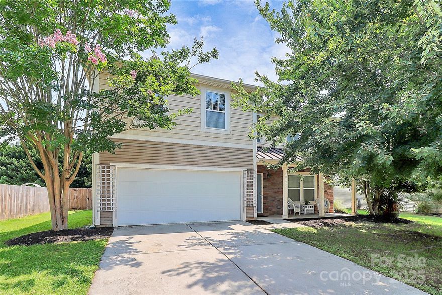 Welcome to this charming two-story home located in the desirable Oaks at Clover! The rocking chair front porch welcomes before entering into a spacious living/dining space. Stepping further inside, you will find a large great room with gas fireplace and semi-opened kitchen. The large kitchen offers ample granite counterspace, lots of cabinets and drawers, custom-made island w butcher block top, oversized walk-in pantry, and breakfast nook. Head upstairs to a cozy flex space to use how best suits your needs. The very generously sized Owner's Suite offers an en suite with double sink vanity, a separate walk-in shower, and soaking tub. Two secondary bedrooms were also generously sized and are separated by a full bathroom. Upstairs laundry for convenient living. The fully fenced, relatively private backyard offers an oversized deck covered by a pergola with a fan and features a bench swing - perfect for relaxing and entertaining! *Seller offering flooring allowance with acceptable offer.