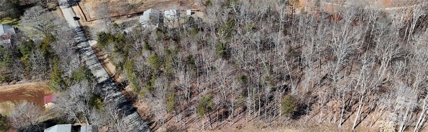 Discover the perfect canvas for your next project or forever home. This beautiful 2.86 acre wooded property offers privacy, space, and natural charm while just being 10 minutes from I-485 and shopping areas.