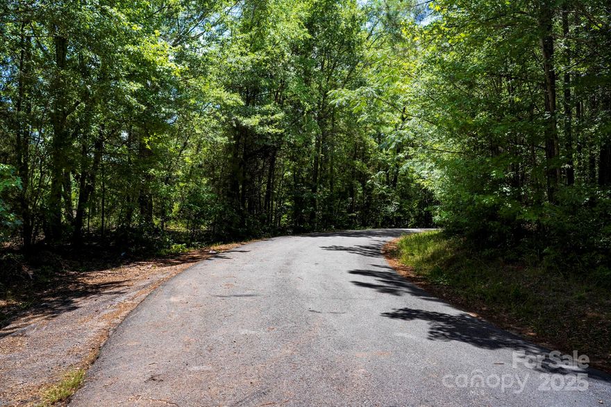 MANUFACTURED HOME APPROVED.  WOODED LOT, SEPTIC APPROVED BY SOIL SCIENTIST, (conventional up to 5 bedrooms). Great location, only minutes from I-385.  8 more lots available from 2.25 acre to 5.6 acres.