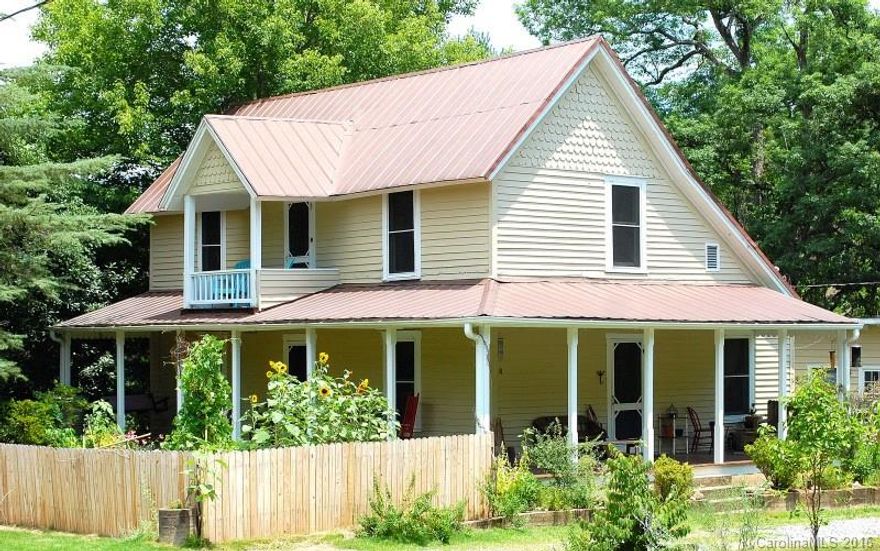 Charming farmhouse w/in walking distance to downtown Tryon! Private, fenced back yard w/ stream, raised beds & large workshop. Inviting wraparound porch perfect for rocking away the day. Updated kitchen, laundry hook-ups added (washer/dryer remain), radiant heated floors in bath. So many vintage details, beautiful hardwood floors, & large rooms. Blueberry bushes, apple, fig & pear trees. Lovely shaded side yard for play. A beautiful home is a wonderful location! Home warranty offered.