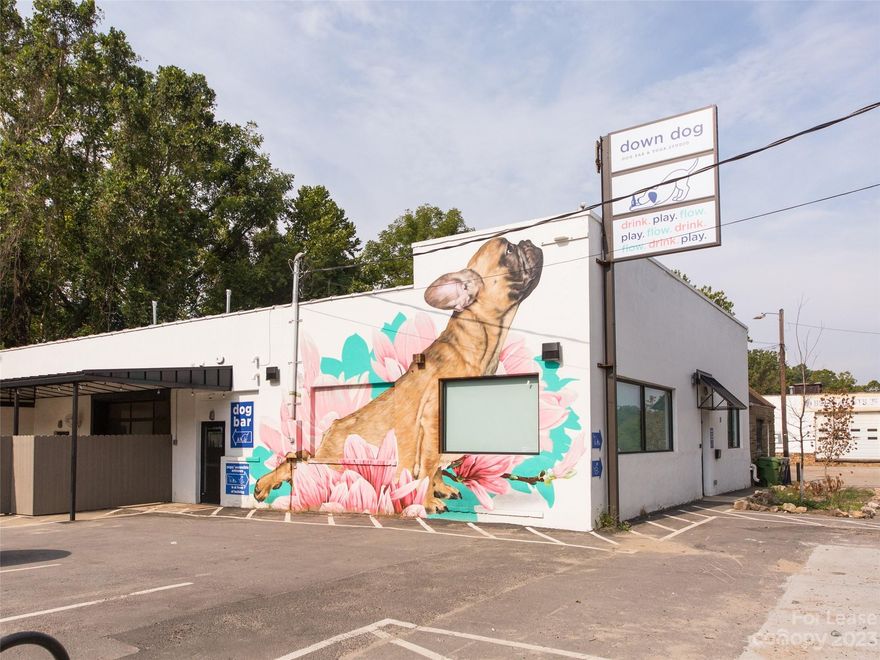 A fantastic lease opportunity right in the heart of the quickly growing Sweeten Creek Road corridor.  A very short distance from Biltmore Village, this area has seen many adaptive reuse projects taking place and has become very desirable for food and beverage, retail, office, and brewery use.  Over the last few years this property has gone through roughly half a million dollars of improvements including an up fit on the rear half of the building as a large open floor plan bar with indoor and outdoor seating, and the front portion as a yoga studio with reception and two private studio spaces.  The property includes indoor and outdoor tables and chairs, a walk-in cooler, ice maker, under bar fridge, three-piece sink, a roll up door, and more.  The property has on-site parking, however, that parking was reduced with the previous tenant's addition of the exterior bar space so a new tenant will need to confirm parking requirements for their specific use.