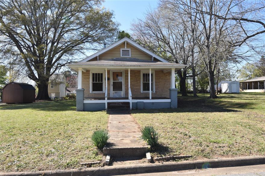 2 Bedroom, 1 Bathroom Bungalow Style Home on level lot  offers lots of opportunities for someone with the skills to remodel and update properties. The living room has a gas line hook up connection for Gas monitor heater or Gas Logs Fire Place. Nice size den with closet. Large Dining Room that leads into the Kitchen. The kitchen is large and had overhead cabinets. There are 2 bedrooms with closets. Hardwood floors though out most of the house. There is no heating, cooling, hot water heater, water or electricity in the home. The house is being SOLD-In As-Is Condition. Will not qualify for FHA, VA, USDA loans. Easy access to 64-70 Highway and I40 Interstate. Easy to see.
