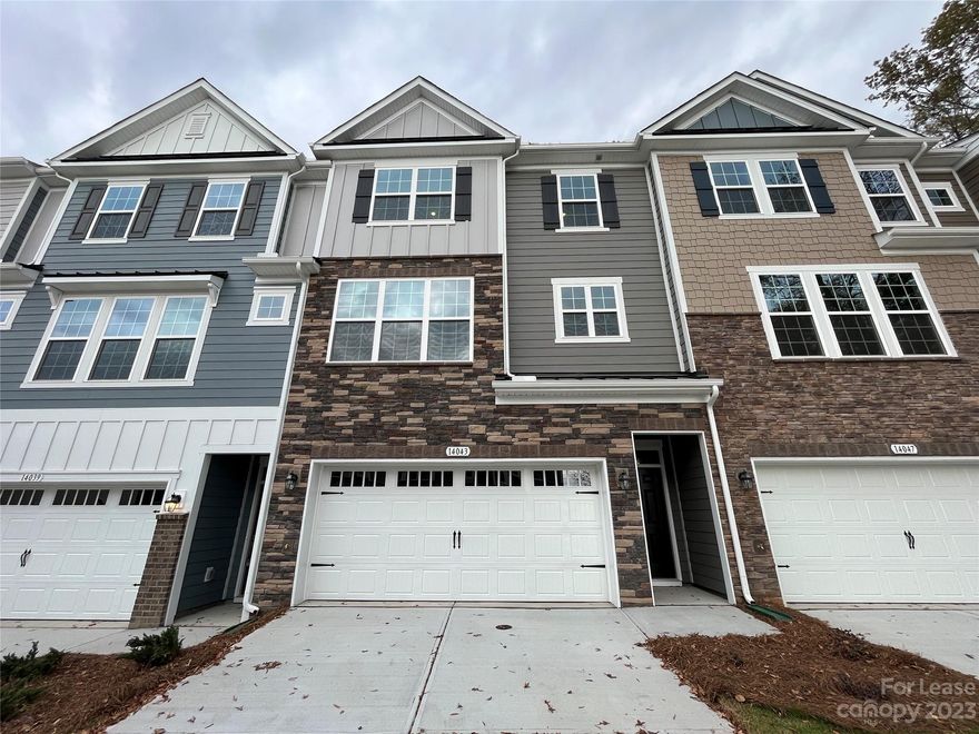 Don't miss out on this gorgeous, BRAND NEW town home in the Ballantyne West community with 4 bedrooms and 3.5 bathrooms! This home offers a first floor bedroom with en suite bath and access to a covered patio with privacy fencing. The main living area features an open plan living room and eat-in kitchen with stainless steel appliances, a new stainless steel refrigerator to be added, granite countertops and an island with breakfast bar. A single French door opens to the backyard deck, perfect for outdoor dining! On the third floor, the primary bedroom is adorned with crown molding, a walk-in closet and an en suite bathroom with dual vanities and a tiled shower. Two additional bedrooms share a 3rd full bathroom!