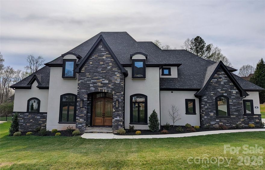 Last new home available in Hunts Landing! Wow your guests as they enter with the stunning curved staircase!  Work from home in your own Private office. Spacious dining room with butlers pantry flows to open floor plan . Cozy up in front of the fireplace in the great room. Incredible chefs kitchen with custom cabinets, Thermador appliances, huge island, farm sink, custom hood, expansive walk in pantry, breakfast bar +  breakfast room. Thermador Appliance package includes 6 burner plus griddle natural gas with double oven range, side by side 30" freezer and 30" refrigerator, drawer microwave and upgraded dishwasher. Amazing attention to details between the intricate ceilings and trim package, bullnose corners, outlets in trim , wide plank hardwood floors to name a few. Primary BR & ensuite has wet room with soaking tub for relaxing. Plus, Massive walk in closet. Secondary BR w/ensuite on main level Roomy outdoor living area featuring grilling area. Upper level has room for all - flex room with oversized closet and second laundry  + rec room  (or second office?)+ oversized media room + 2 BRs with ensuites & WICs.  Laundry on both levels. Amazing amount of walk in storage. Property was designed to accommodate a pool! And with that in mind there is access to bath from rear yard.  3 car garage with extra workshop area. Oversized driveway allows for extra parking without shuffling cars. No steps for either entry from garage to house! Uplighting makes the home elegant at night. Full yard irrigation.. but remember no water bill as is on well water. So convenient to shopping and restaurants. Cul de sac street of European inspired grand homes with NO HOA.  Plenty of room inside and out!  Come make this new incredible luxury home yours! QUICK DELIVERY!! BUYERS AGENTS WELCOME