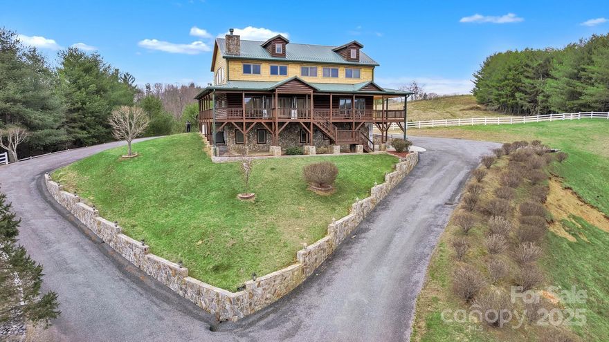 Amazing views from this home Come sit on the front porch and admire the beauty! As you enter the main level, discover a seamless flow through the living area, featuring a chef's kitchen equipped w/stainless appliances throughout & granite counters and a long bar/table which make it perfect for family gatherings. The inviting great room boasts vaulted ceilings and a cozy gas-burning fireplace with two sitting areas perfect for creating cherished memories. On this level, you’ll also find 2 bedrooms & 2 full baths along with a half bath for added convenience. Steps away go to the upper level to explore a reading loft plus the master suite which provides privacy & comfort. the Master suite including the master bath which has a jacuzzi tub and steam shower ensures a private area while you are getting ready. Additional phenomenal views just outside the master bedroom windows. The lower level houses 2 bedrooms and full bath ensuring ample space for everyone to relax and unwind while visiting.