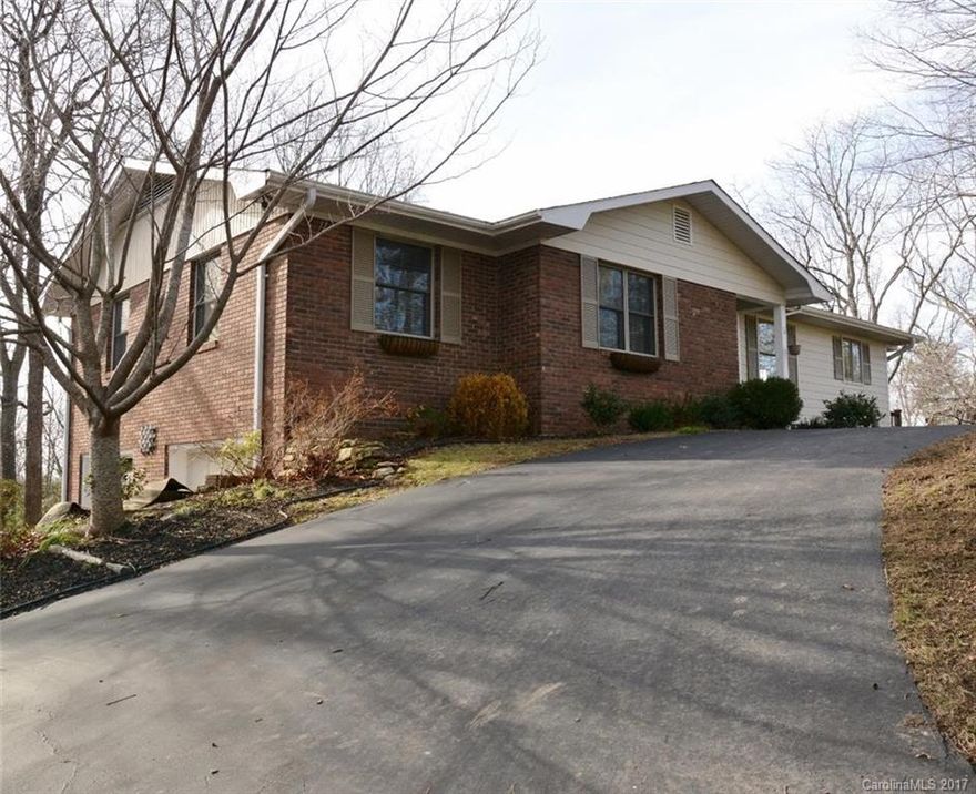 Mountain & Sunset views! Driveway to front door. Features tile floor in kitchen and baths, hardwood floors in hall & entry LR & DR, screened porch & deck,2 FP, a finished lower level & FR w/built-ins and bonus room. 2 car garage & workshop. Wonderfully landscaped yard w/rock walls, pond, paver patio, yard & garden areas with shed w/electric. Updates in last 7 years: crown molding, HVAC, gas water heater/dryer/range/grill, roof, countertops.