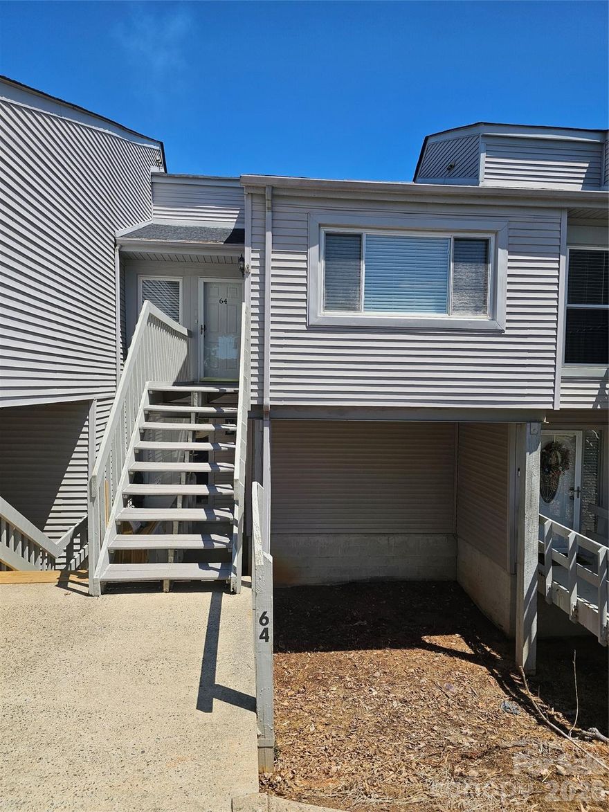 Welcome to easy living on Lake Hickory! This cozy condo is just outside of town but close enough to enjoy all that Hickory has to offer.  Watch boaters go by on your top floor back deck, take a stroll to either of the 2 parks/walking trails near by or sunbath on the dock on the lake.  Monthly HOA dues include water, sewer and trash pickup.  Top floor also means cathedral ceilings and tons of natural light.  New laminate flooring throughout makes cleaning a breeze! Lake Hickory Condos was formerly Quail Run. Clubhouse pool has been drained for repairs but will back up and running for summer!