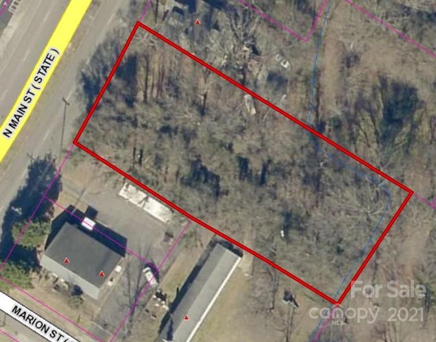 Located in the Central Business District of Clover.  Mostly Level 0.735 Acre Lot-zoned B-2 & R-12. If you are looking for a commercial building lot with US Highway frontage then this is the lot to consider. City Water & Sewer are available to this site, but taps are not present on this property.  Taps will be the expense of the buyer.